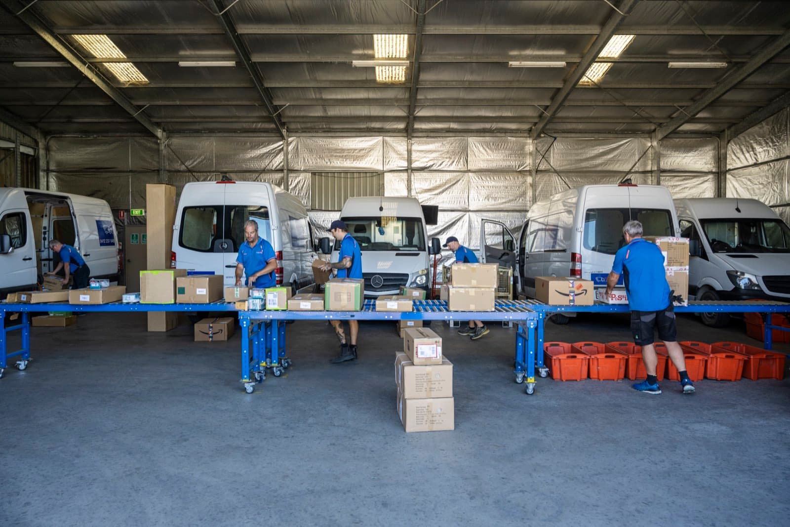 The Fleurieu Logistics van fleet lined up, ready for the day's runs